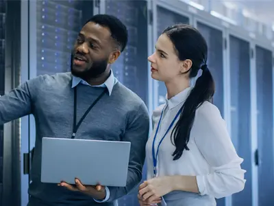 two IT professionals in the server room