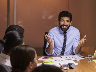 black male presenting to a group of people