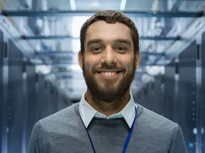 database professional smiling at camera