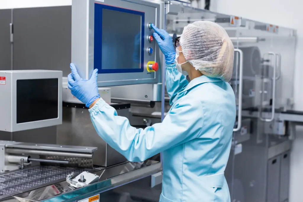 Sterile Processing Technician starting sterile machine.