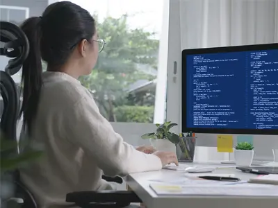 female tech working on computer